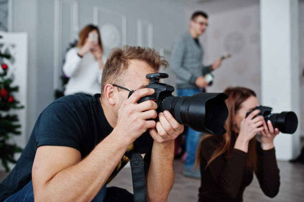 Second wedding photographer shooting photos